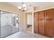Bright eat-in kitchen with tile floors, pantry, and a sliding glass door to the backyard patio at 10324 W Sands Dr # 476, Peoria, AZ 85383