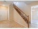 Spacious foyer featuring tile flooring, staircase, and a front door view at 10324 W Sands Dr # 476, Peoria, AZ 85383