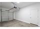 A well lit two car garage with an automatic door opener and side access door at 10324 W Sands Dr # 476, Peoria, AZ 85383