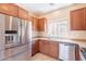 The kitchen features stainless steel appliances and cabinetry at 10324 W Sands Dr # 476, Peoria, AZ 85383