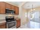 Modern kitchen with stainless steel appliances and an open layout to the patio at 10324 W Sands Dr # 476, Peoria, AZ 85383