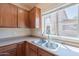 Kitchen featuring stainless steel sink and view from the window at 10324 W Sands Dr # 476, Peoria, AZ 85383