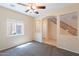 The spacious living room provides views of the stairwell and a front-facing window at 10324 W Sands Dr # 476, Peoria, AZ 85383