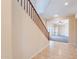 An entry staircase with tile flooring, wood railing, and a view of the living area at 10324 W Sands Dr # 476, Peoria, AZ 85383