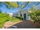 Beautiful backyard featuring lush grass, mature trees, and white modern home with upstairs deck at 10532 N 79Th St, Scottsdale, AZ 85258