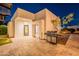 Backyard features a stone-paved patio with a built-in stainless steel grill and landscaping at 10532 N 79Th St, Scottsdale, AZ 85258