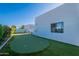 Backyard featuring a putting green, stucco wall, and desert landscaping at 10532 N 79Th St, Scottsdale, AZ 85258