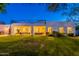 Spacious backyard with a covered patio, spiral staircase, and a well-manicured lawn at 10532 N 79Th St, Scottsdale, AZ 85258