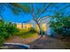Beautiful backyard with lush greenery, mature trees, and a view of the home's exterior at 10532 N 79Th St, Scottsdale, AZ 85258