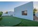 Backyard featuring a putting green, stucco wall, and desert landscaping at 10532 N 79Th St, Scottsdale, AZ 85258
