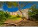 Backyard featuring lush lawn, mature trees, and well-maintained landscaping around the perimeter at 10532 N 79Th St, Scottsdale, AZ 85258