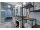 Bathroom features a stone countertop, a dual vanity, and a glass enclosed shower with a soaking tub at 10532 N 79Th St, Scottsdale, AZ 85258