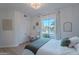 Inviting bedroom with natural light, closet, hardwood floors, and a view of the neighborhood at 10532 N 79Th St, Scottsdale, AZ 85258