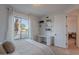 Bright bedroom with white walls, window view, light hardwood floors, and built in desk and shelves at 10532 N 79Th St, Scottsdale, AZ 85258