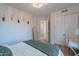 Bedroom with hardwood floors, closet, desk, and cozy decor at 10532 N 79Th St, Scottsdale, AZ 85258