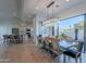 Spacious dining room features a modern chandelier and opens to the kitchen and outdoor patio at 10532 N 79Th St, Scottsdale, AZ 85258