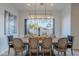 Chic dining room featuring a modern chandelier, ample seating, and view of the backyard at 10532 N 79Th St, Scottsdale, AZ 85258