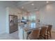 Bright kitchen features stainless steel appliances, white cabinets, and a large center island at 10532 N 79Th St, Scottsdale, AZ 85258