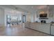 Open-concept living and dining area featuring a cozy fireplace, modern lighting, and neutral decor at 10532 N 79Th St, Scottsdale, AZ 85258