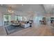 Bright and open living room with hardwood floors, a large sectional sofa, and access to the backyard at 10532 N 79Th St, Scottsdale, AZ 85258