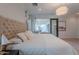 Spacious bedroom with natural light, a comfortable bed, and a view to a private patio at 10532 N 79Th St, Scottsdale, AZ 85258
