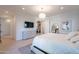 Bedroom featuring natural light, a dresser with a television, and a comfortable bed at 10532 N 79Th St, Scottsdale, AZ 85258