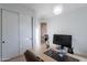 Office space with desk, sliding closet doors, neutral paint, and light hardwood floors at 10532 N 79Th St, Scottsdale, AZ 85258