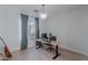 This bright office features neutral paint, hardwood floors, a desk, and light fixture at 10532 N 79Th St, Scottsdale, AZ 85258