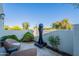 Serene patio featuring a modern fountain, comfortable seating, and lush greenery at 10532 N 79Th St, Scottsdale, AZ 85258