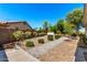 Backyard features mature trees, a walkway and manicured landscaping at 1096 E Lodgepole Dr, Gilbert, AZ 85298
