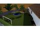 Well-maintained backyard featuring green grass, a trampoline, soccer net, and play area at 1096 E Lodgepole Dr, Gilbert, AZ 85298