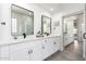 Stylish bathroom with double vanity, sleek black fixtures, and contemporary mirrors at 1096 E Lodgepole Dr, Gilbert, AZ 85298