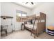 bedroom featuring bunk beds, modern decor, neutral carpet, and a window with natural light at 1096 E Lodgepole Dr, Gilbert, AZ 85298