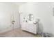 Bright bedroom featuring white walls, a modern dresser with a decorative mirror, and neutral carpeting at 1096 E Lodgepole Dr, Gilbert, AZ 85298
