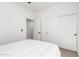 Bedroom showcasing a clean and minimalist design with a large closet and neutral color palette at 1096 E Lodgepole Dr, Gilbert, AZ 85298