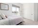 Bedroom featuring a twin bed, sliding door closet, neutral carpet, and a view of the neighborhood at 1096 E Lodgepole Dr, Gilbert, AZ 85298