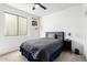 Bedroom showcasing a gray bed, basketball hoop, and modern furnishings at 1096 E Lodgepole Dr, Gilbert, AZ 85298