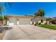 Attractive home featuring a tile roof, three-car garage, and a well-manicured front yard at 1096 E Lodgepole Dr, Gilbert, AZ 85298