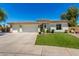 Charming home featuring a tile roof, a three-car garage, and a well-manicured front yard at 1096 E Lodgepole Dr, Gilbert, AZ 85298