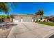 Inviting home featuring a tile roof, a three-car garage, and desert landscaping at 1096 E Lodgepole Dr, Gilbert, AZ 85298
