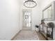 Bright foyer showcasing a modern light fixture, stylish decor, and a decorative mirror at 1096 E Lodgepole Dr, Gilbert, AZ 85298