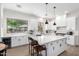 Well-lit kitchen with ample counter space, stainless steel appliances, and a clear view of the backyard, perfect for cooking at 1096 E Lodgepole Dr, Gilbert, AZ 85298