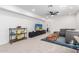 Entertainment area with a large television, comfortable seating, and a stylish display shelf at 1096 E Lodgepole Dr, Gilbert, AZ 85298