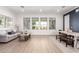 Bright living area featuring neutral walls, wood floors, and large windows at 1096 E Lodgepole Dr, Gilbert, AZ 85298