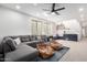 Cozy living room with a gray sectional sofa, beanbag chairs, and a built-in entertainment area at 1096 E Lodgepole Dr, Gilbert, AZ 85298