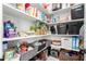 Organized pantry with shelves stocked with food, baskets, and storage containers, providing ample storage space at 1096 E Lodgepole Dr, Gilbert, AZ 85298