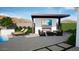Beautiful outdoor patio with fireplace, seating area, and view of the mountains at 1096 E Lodgepole Dr, Gilbert, AZ 85298
