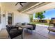 Relaxing covered patio with comfortable furniture and open view of yard at 1096 E Lodgepole Dr, Gilbert, AZ 85298