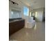 Primary bathroom showcasing a soaking tub and a double sink vanity at 10984 N 164Th Dr, Surprise, AZ 85388
