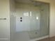 Walk-in shower featuring sleek glass enclosure and subway tile at 10984 N 164Th Dr, Surprise, AZ 85388